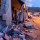Debris of a partially collapsed house sit on the street in Fleri, Sicily Italy, Wednesday, Dec. 26, 2018. A quake triggered by Italy's Mount Etna volcano has jolted eastern Sicily, slightly injuring 10 people and prompting frightened Italian villagers to flee their homes. (AP Photo/Salvatore Allegra)